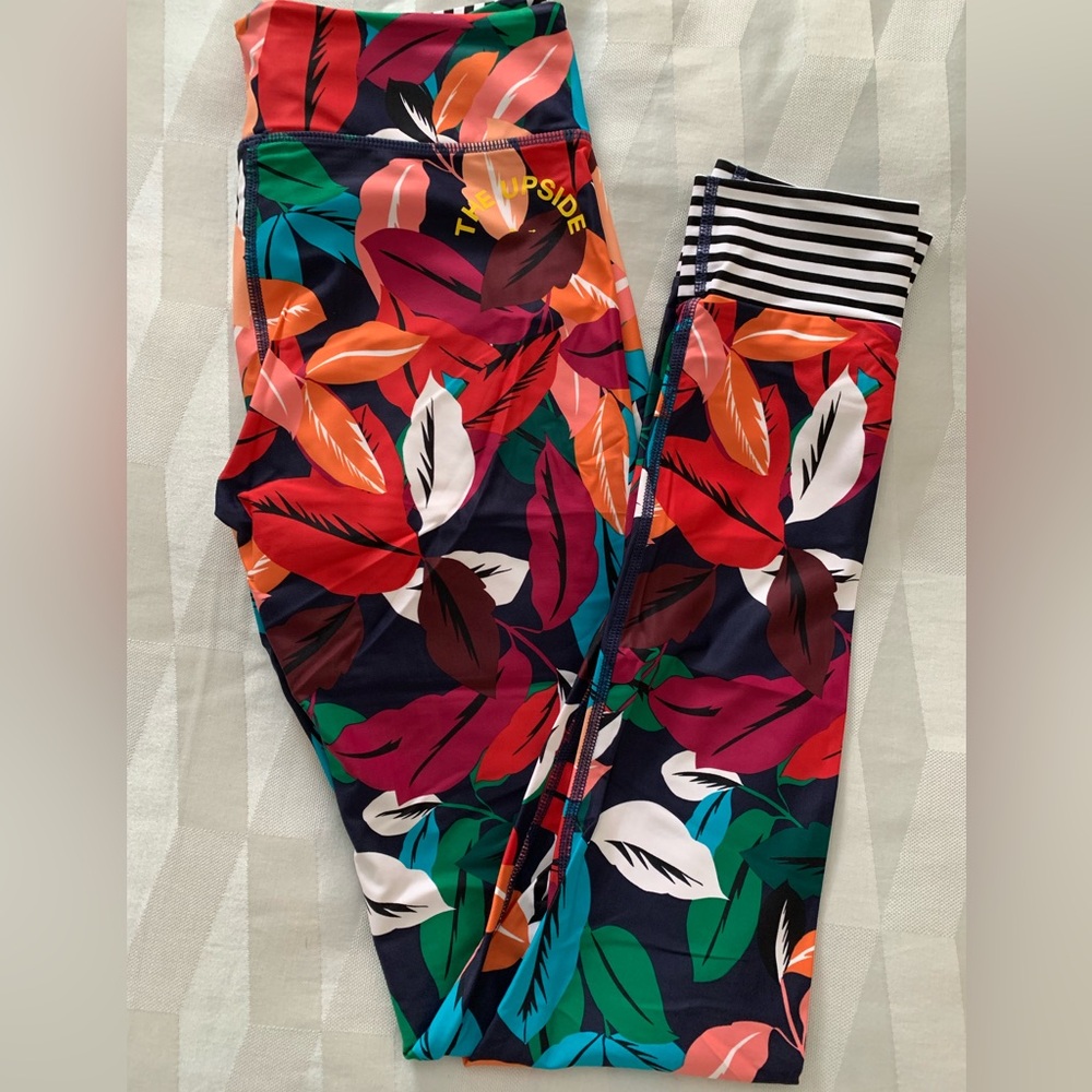 The Upside Feather leggings with navy and white striped cuffs, size large